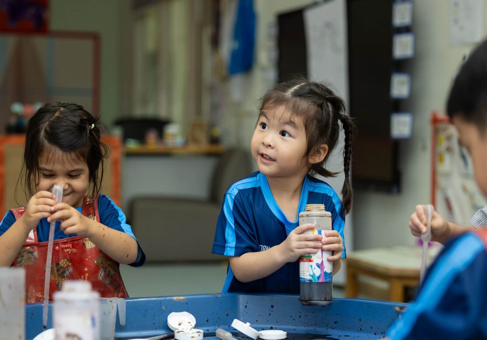Reception (K2) children concentrating on a hands-on activity at St. Andrews Sathorn